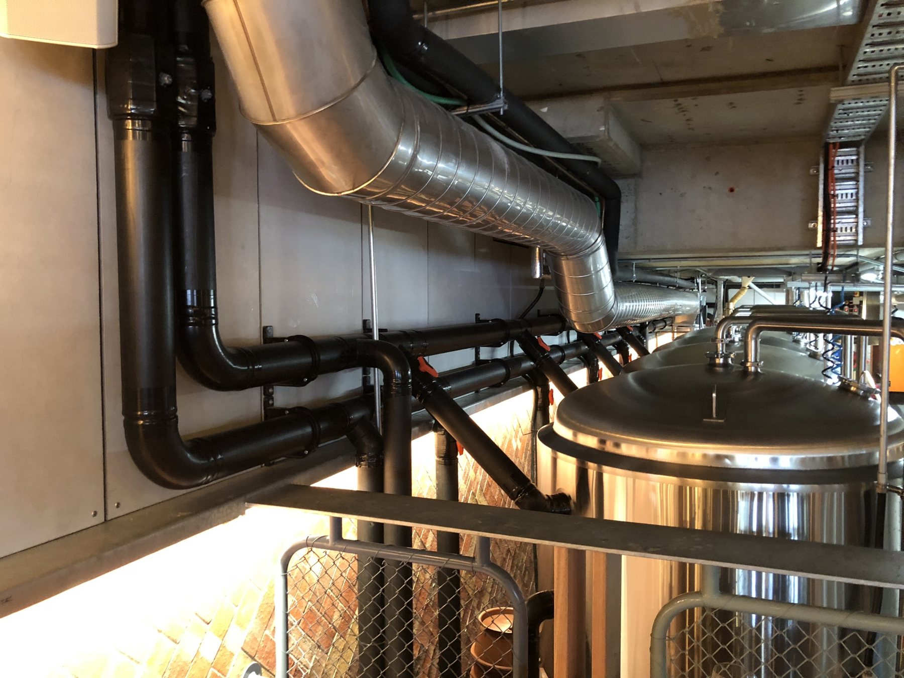 Stainless glycol and refrigeration pipework over brewing tanks