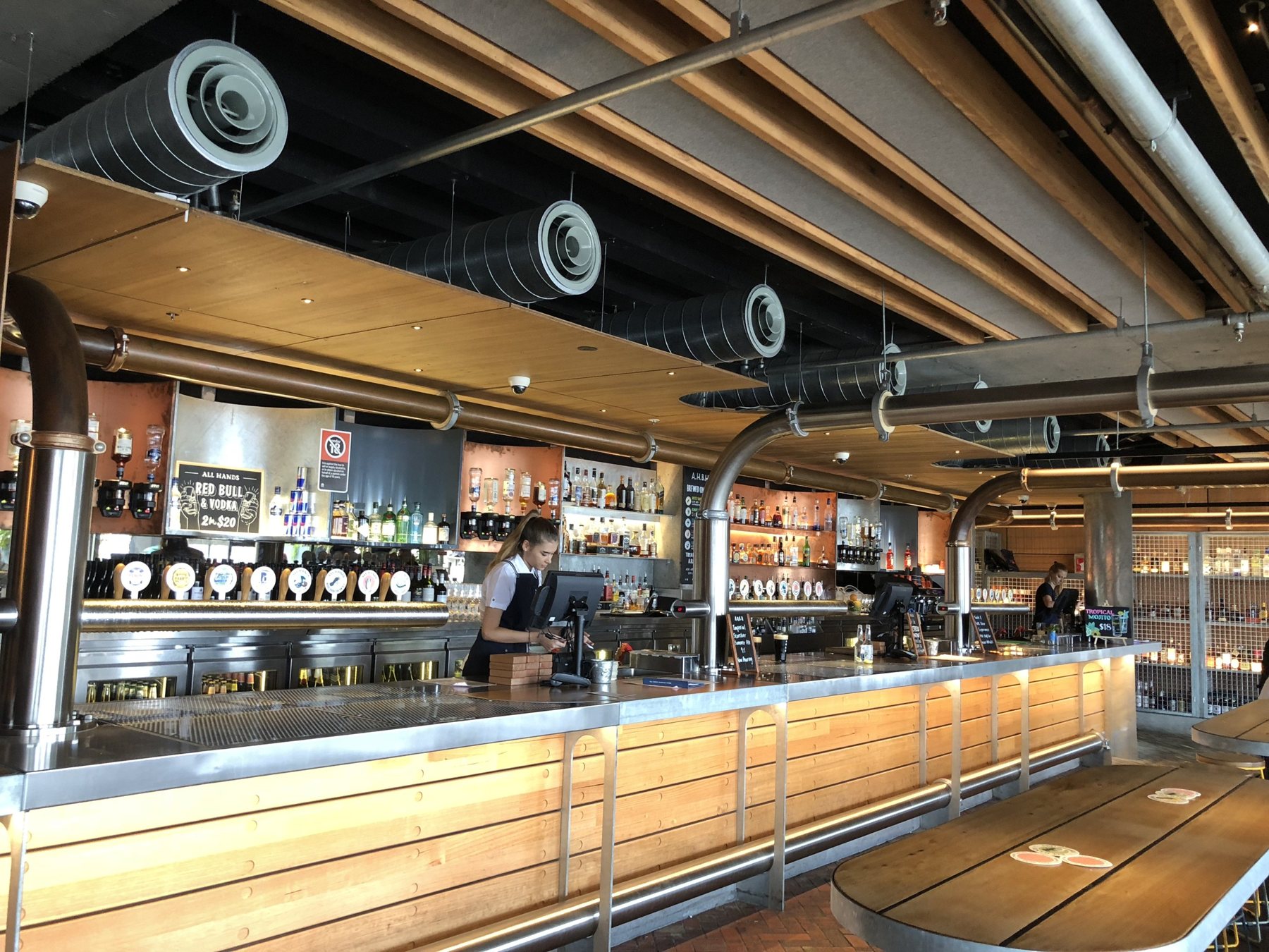 Long bar with multiple tap stations and glass chillers