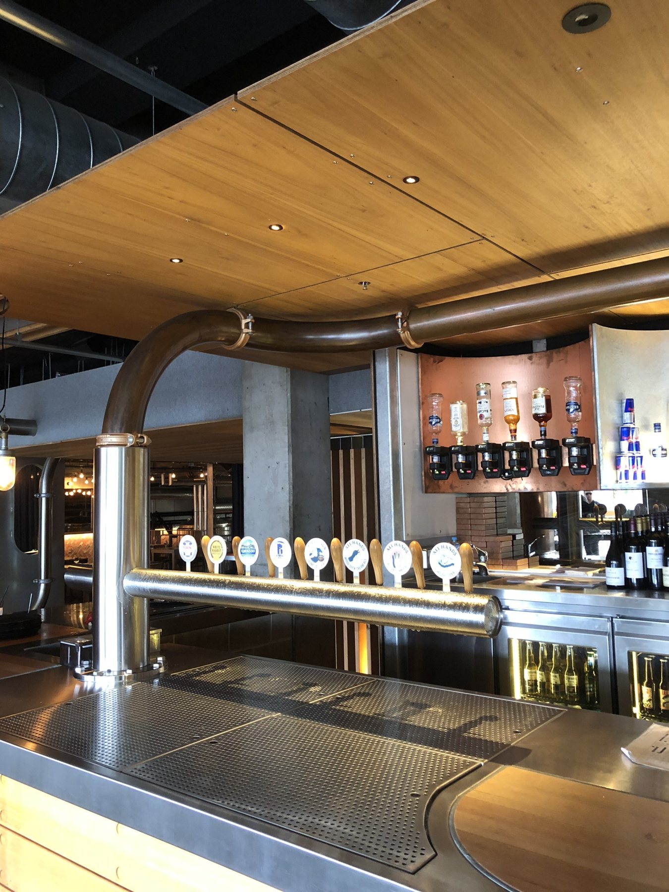 Elegant venue bar with arched columns and multiple tap stations